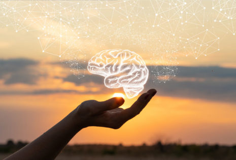 hand holding hologram of brain