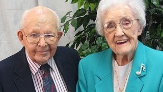 old couple smiling for picture