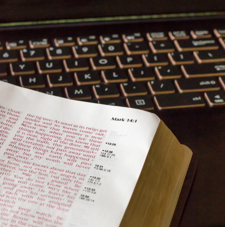 closeup of bible and computer