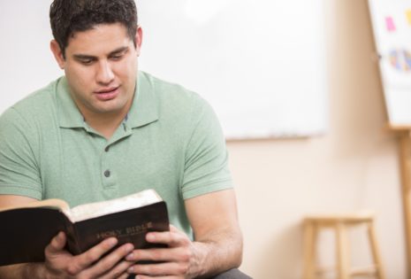 man reading bible