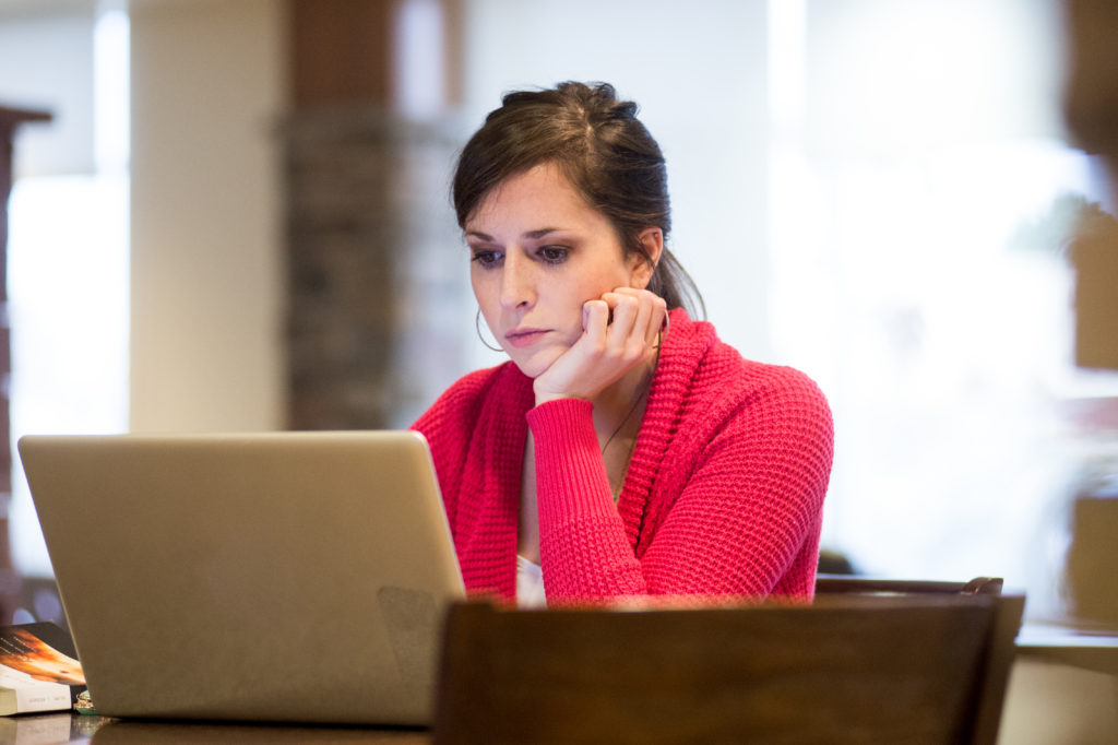 woman looking at laptop