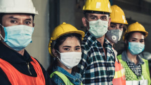five construction workers looking at camera