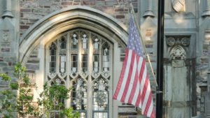 american flag in front of church