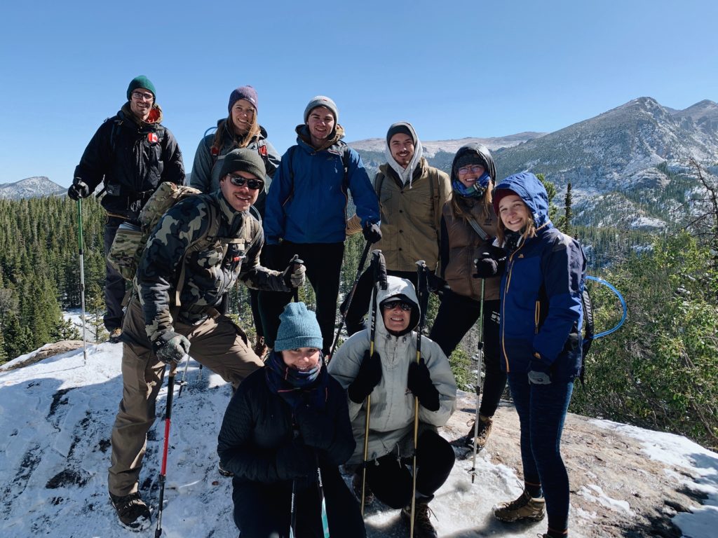 Students hiking outdoors in the mountains in the winter