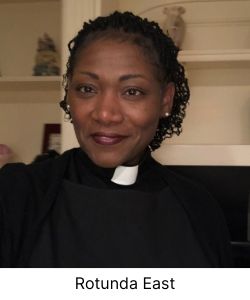 Black woman in ministers collar smiling at camera